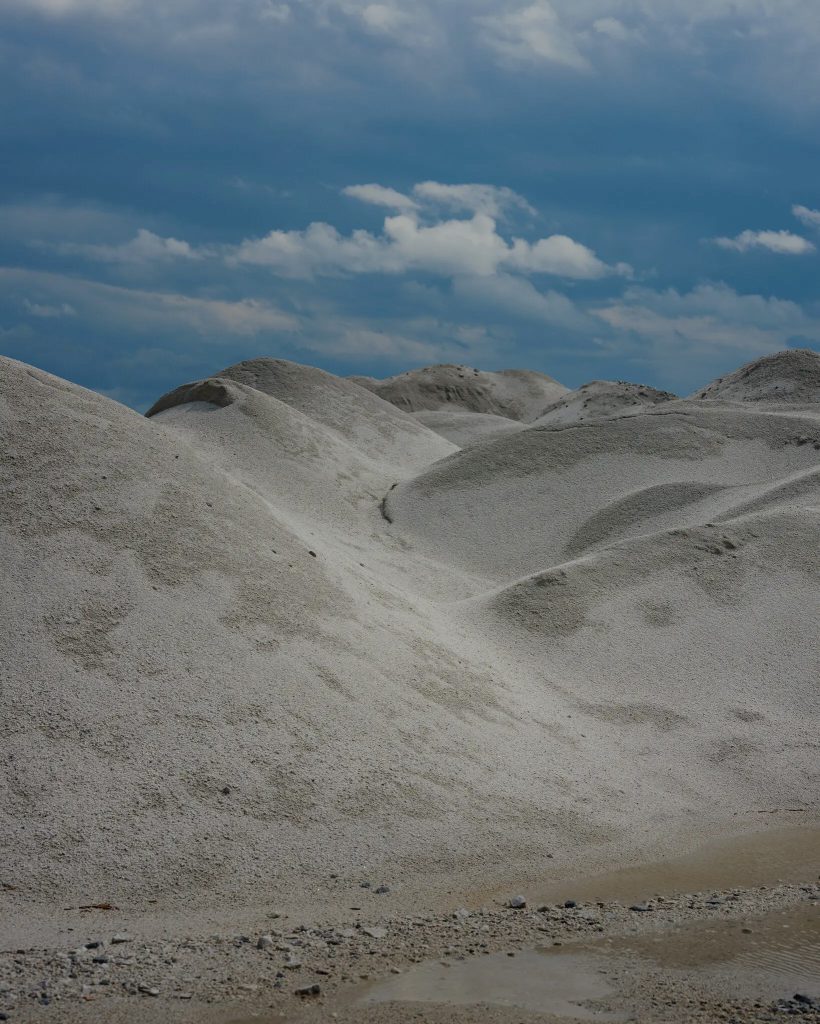 Broken-down spodumene, a source of lithium, at a mine outside La Corne, Quebec. Credit...Brendan George Ko for The New York Times